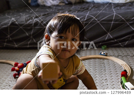 Toddler Playing With Wooden Toys, Background for advertising and wallpaper in education and lifestyle scene. Toddler Playing With Wooden Toys, Background for advertising and wallpaper in education and lifestyle scene. 127996489