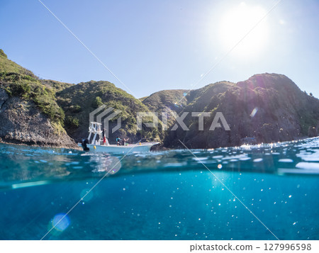 Half-surface photo of the Hirizohama ferry boat with the captain and skin divers on board. Hirizohama, Nakagi, Minamiizu Town, Izu Peninsula, Shizuoka Prefecture 127996598