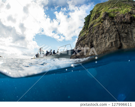 Half-surface photo of the Hirizohama ferry boat with the captain and skin divers on board. Hirizohama, Nakagi, Minamiizu Town, Izu Peninsula, Shizuoka Prefecture 127996611