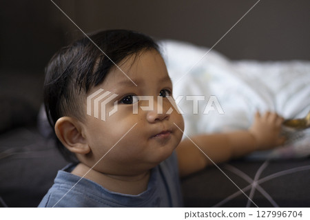 Indoor Portrait Of Toddler, Background for advertising and wallpaper in food and drink lifestyle scene. Indoor Portrait Of Toddler, Background for advertising and wallpaper in food and drink lifestyle scene. 127996704