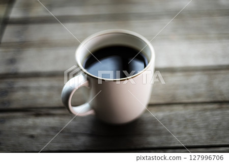 Coffee Mug On Wooden Table. Background for advertising and wallpaper in drink and coffee scene. Coffee Mug On Wooden Table. Background for advertising and wallpaper in drink and coffee scene. 127996706