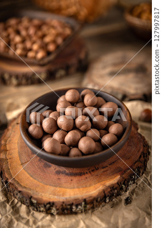 Chocolate covered hazelnuts Chocolate covered hazelnuts 127997817