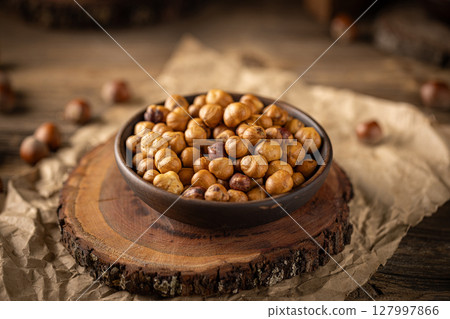 Close up of roasted hazelnuts Close up of roasted hazelnuts 127997866