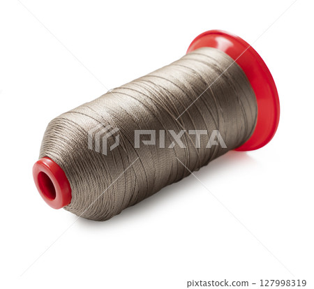 spool of sewing thread close up 127998319