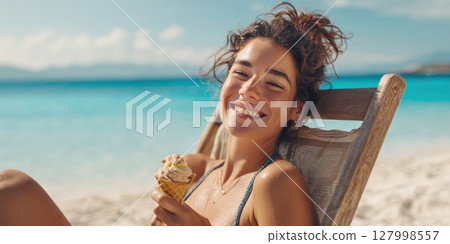 Radiant Beach Bliss: Joyful Woman Savoring a Delicious Ice Cream Cone While Relaxing on a Sun-Drenched Tropical Shoreline 127998557