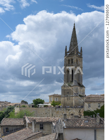 Saint-Emilion troglodytic church and vineyard landscape in Bordeaux during spring Saint-Emilion troglodytic church and vineyard landscape in Bordeaux during spring 127998650