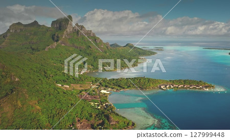 Capturing breathtaking drone footage of Bora Bora, featuring iconic mount Otemanu, luxurious overwater bungalows, and vibrant coral reefs in a tropical paradise. Travel tropical vacation concept Capturing breathtaking drone footage of Bora Bora, featuring iconic mount Otemanu, luxurious overwater bungalows, and vibrant coral reefs in a tropical paradise. Travel tropical vacation concept 127999448