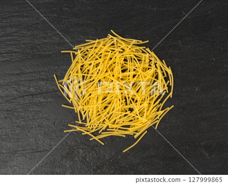 Raw vermicelli, gold soup pasta, small scattered homemade noodles, thin macaroni Raw vermicelli, gold soup pasta, small scattered homemade noodles, thin macaroni 127999865