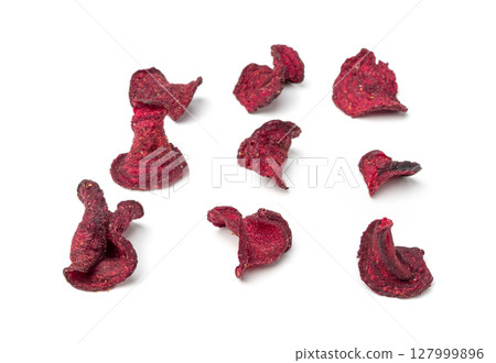Dry beetroot chips isolated, dried sliced red beet flakes pile, beet root pieces and chips 127999896