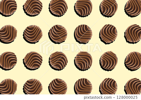 Top view of round milk chocolate pralines arranged in a regular pattern Top view of round milk chocolate pralines arranged in a regular pattern 128000025