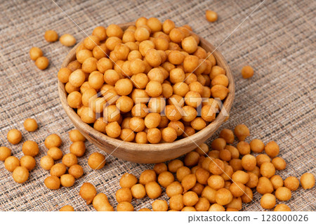 Small pastry balls, fried crispy wheat soup pearls, salad egg puffs or choux pastry Small pastry balls, fried crispy wheat soup pearls, salad egg puffs or choux pastry 128000026