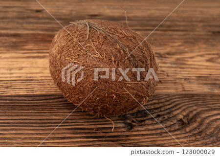 Whole coconut, one coco nut, single fresh tropical palm fruit, natural milk, oil ingredient Whole coconut, one coco nut, single fresh tropical palm fruit, natural milk, oil ingredient 128000029