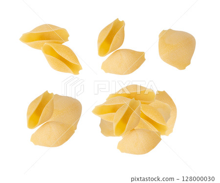 Raw conchiglioni pasta isolated. Dry conchiglie noodle in shell shape, big Italian macaroni 128000030