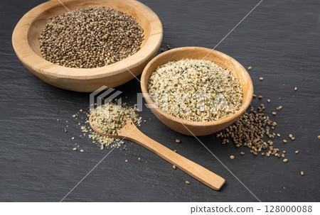 Shelled hemp seeds pile, peeled cannabis grains, marijuana kernels without peel 128000088