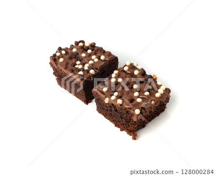 Chocolate brownie cake sprinkled with white and dark balls, classic birthday brownie square piece 128000284