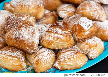 Many sfogliatella cakes on street market. Sfogliatelle puff pastry, naples bakery 128000304