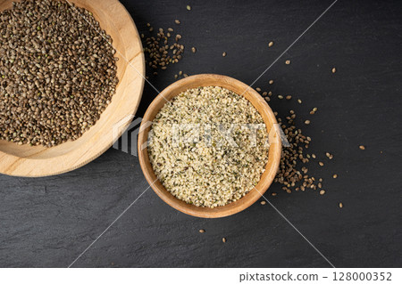 Shelled hemp seeds pile, peeled cannabis grains, marijuana kernels without peel 128000352