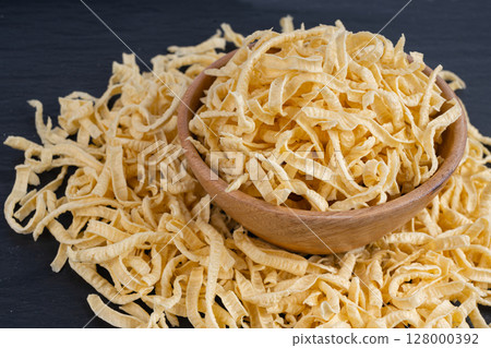 Passatelli spatzle pasta in bowl, raw spaetzle noodles, dry homemade german macaroni Passatelli spatzle pasta in bowl, raw spaetzle noodles, dry homemade german macaroni 128000392