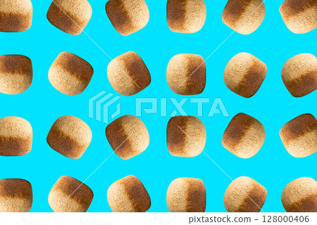 Homemade whole grain bread pattern on blue background, wholegrain loaf bun 128000406