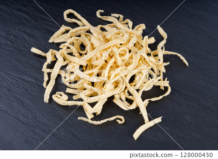 Passatelli spatzle pasta pile, raw spaetzle noodles, dry homemade german macaroni, swabian spaetzle 128000430