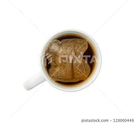 Herbal tea sachet in cup, hot water with chamomile and Hypericum or St. John's wort teabag 128000449