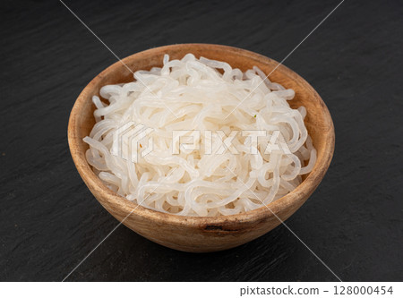 Shirataki or konnyaku pasta in wood bowl. Konjak jelly noodles, Japanese zero calorie sirataki 128000454