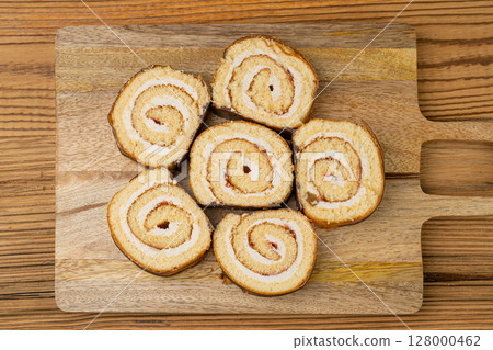 Swiss Roll, Round Sponge Cake, Sliced Rolled Vanilla Biscuit with Jam Filling, Swiss Dessert, Log Cake 128000462