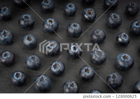 Blueberry texture background. Fresh blue berry fruits pattern, bilberry wallpaper with copy space Blueberry texture background. Fresh blue berry fruits pattern, bilberry wallpaper with copy space 128000625