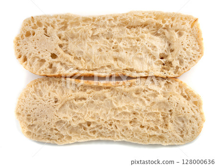 Focaccia flatbread slice macro texture, baked dough pattern. White bread loaf cut close up Focaccia flatbread slice macro texture, baked dough pattern. White bread loaf cut close up 128000636