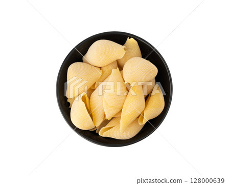 Raw conchiglioni pasta isolated. Dry conchiglie noodle in shell shape, big Italian macaroni 128000639
