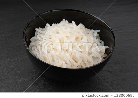 Shirataki or konnyaku pasta in black bowl. Konjak jelly noodles, Japanese zero calorie sirataki 128000695