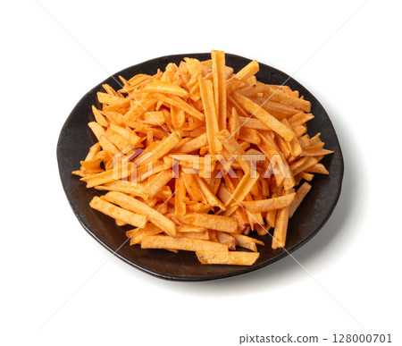 Fried chips sticks isolated, finger potato chips, golden shoestring fries pile, French fries Fried chips sticks isolated, finger potato chips, golden shoestring fries pile, French fries 128000701