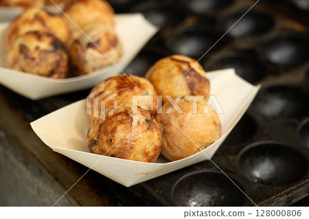 Takoyaki - traditional Japanese street food, Osaka outdoor snack with octopus, takoyaki fried balls Takoyaki - traditional Japanese street food, Osaka outdoor snack with octopus, takoyaki fried balls 128000806
