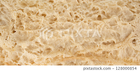 Focaccia flatbread slice macro texture, baked dough pattern. White bread loaf cut close up 128000854
