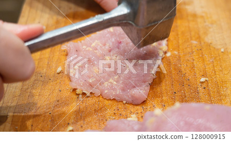 Tenderize meat, beating, hammering fillet pieces, cooking schnitzel process closeup Tenderize meat, beating, hammering fillet pieces, cooking schnitzel process closeup 128000915