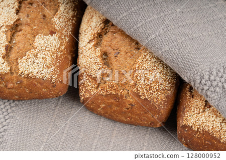 Whole wheat brown bread, fitness pumpkin carrot buns with seeds, cereal bread grain bun Whole wheat brown bread, fitness pumpkin carrot buns with seeds, cereal bread grain bun 128000952