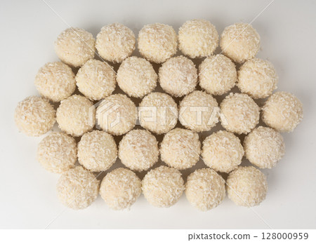 Coconut candies isolated, coco balls set. White truffle ball, indian ladoo or laddu with sweet cream 128000959