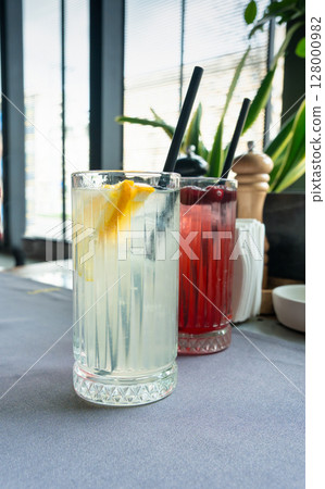 Ice lemonade in tall glass. Yuzu mocktail with lemon and soda, cool lime juice cocktail 128000982
