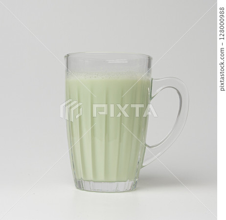 Vanilla milk shake in glass. Milkshake on yellow background, white whey protein smoothie 128000988