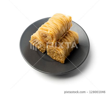Rolled Baklava Isolated, Ramadan Dessert Roll on Restaurant Plate, Eastern Sweet Pastries Rolled Baklava Isolated, Ramadan Dessert Roll on Restaurant Plate, Eastern Sweet Pastries 128001046