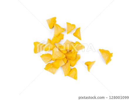 Marinated sliced patty pan cuts isolated, pickled pattypan squash pieces, salted yellow patisson Marinated sliced patty pan cuts isolated, pickled pattypan squash pieces, salted yellow patisson 128001099