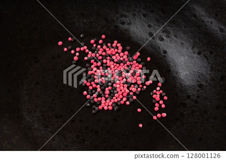 Candy sprinkle pile, round sugar sprinkles, small sweet color confectionery decoration balls 128001126