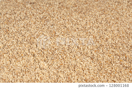 Milk thistle seeds powder, crushed silybum marianum grains pile, milled dry blessed milkthistle 128001168