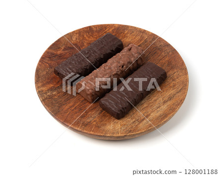 Protein bar isolated, chocolate energy paleo snack, healthy cereal nutrition with nuts, fruits, muesli Protein bar isolated, chocolate energy paleo snack, healthy cereal nutrition with nuts, fruits, muesli 128001188