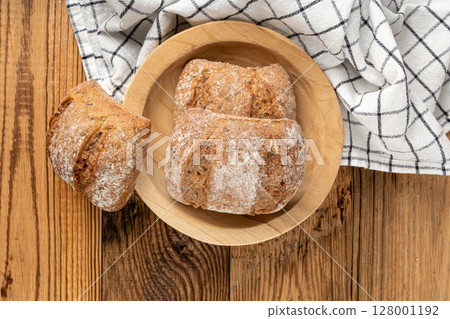 Brown rye bun, square gluten free bread, whole grain healthy breakfast bread Brown rye bun, square gluten free bread, whole grain healthy breakfast bread 128001192