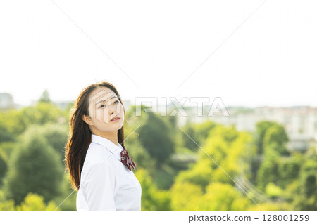 High school girl gazing at the sky 128001259