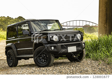 An off-road car parked on the road 128001677