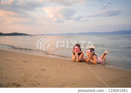 Joyful moments at the beach with family enjoying the sunset Joyful moments at the beach with family enjoying the sunset 128001981