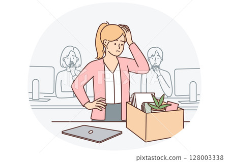 Upset woman standing near table with box after dismissal of manager or secretary position Upset woman standing near table with box after dismissal of manager or secretary position 128003338
