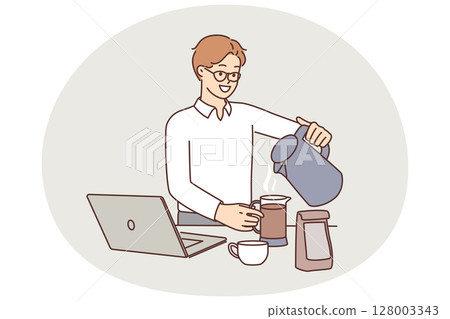 Man office worker brews coffee zero hot water from kettle at table with laptop 128003343